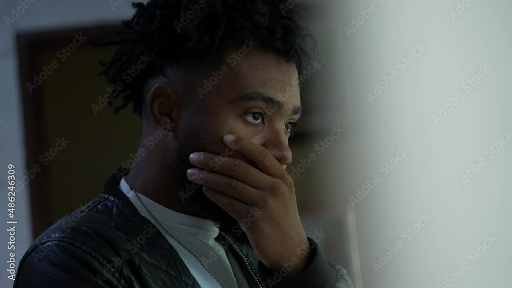 A pensive black man thinking a thoughtful African person contemplating dilemma A pensive black man thinking a thoughtful African person contemplating dilemma