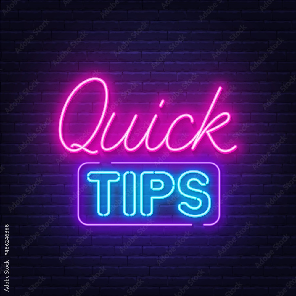 Quick Tips neon sign on brick wall background.