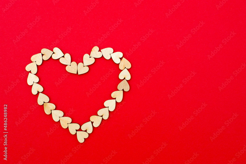 Red heart on red background. Flat lay, top view, copy space. Valentines day background.