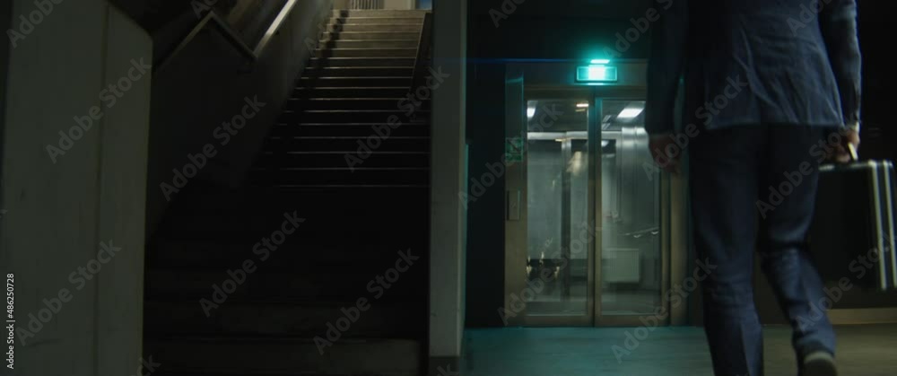 Man with a rabbit head in an elevator Man with a rabbit head in an elevator