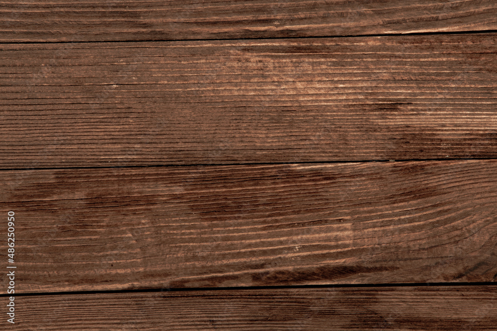 Fototapeta premium Painted wooden board for design or text. Colored wood abstraction.