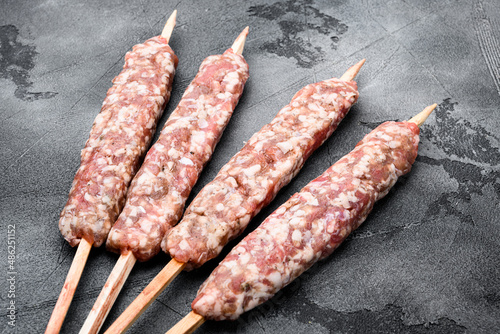 Raw Minced Lamb Shish Kebab kofta, on gray stone table background