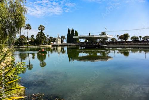 A green park with a lake and sculptures in the city of New Athos, Abkhazia. 2019. Georgia.