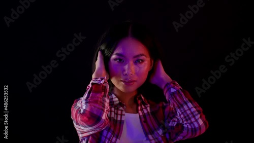 Wallpaper Mural Beautiful Asian Woman In Neon Lights Touching Hair And Looking At Camera Torontodigital.ca
