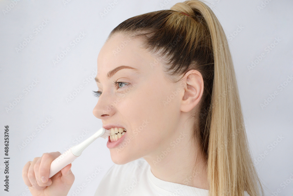 pretty woman brushing her teeth pretty woman brushing her teeth