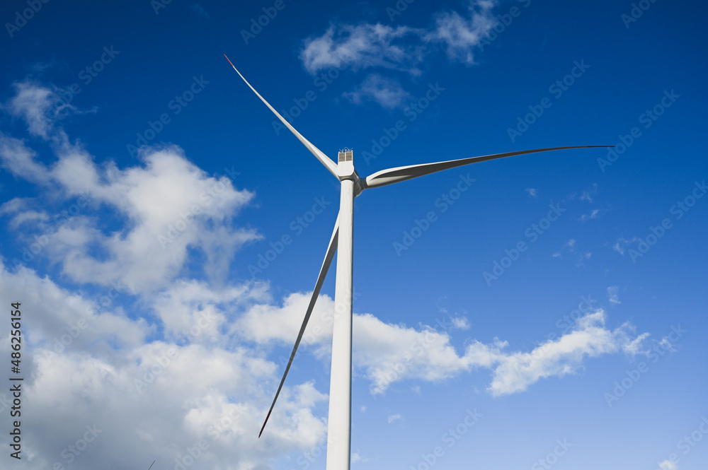 Wind turbine. Wind farm against blue sky. Wind turbines on the hill. Producing electric energy. Renewable energy. Wind park. Wind turbine. Wind farm against blue sky. Wind turbines on the hill. Producing electric energy. Renewable energy. Wind park.