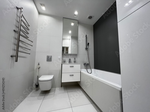modern white bathroom interior with bath