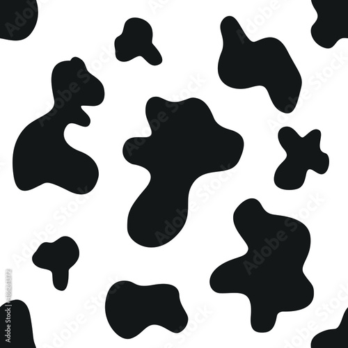 Black spots on a white background. Vector pattern. Dalmatian pattern.