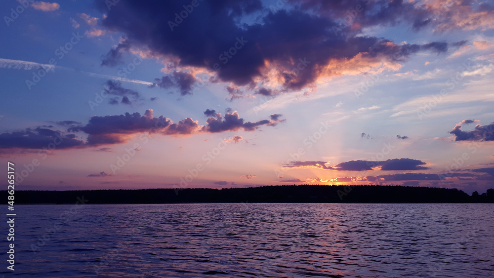 Naklejka premium Beautiful landscape on sunrise. Seascape. View beautiful nature early in the morning. Zen. Trendy Toned in Color of the year 2022, Very Peri.