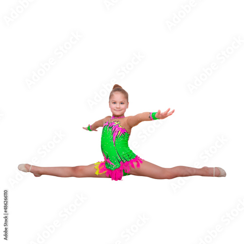 Fototapeta Naklejka Na Ścianę i Meble -  Rhythmic gymnastics - beginner young sportswoman performs gymnastic exercises