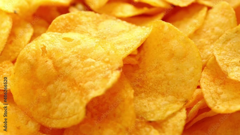 a bunch of golden chips spin in a circle a bunch of golden chips spin in a circle