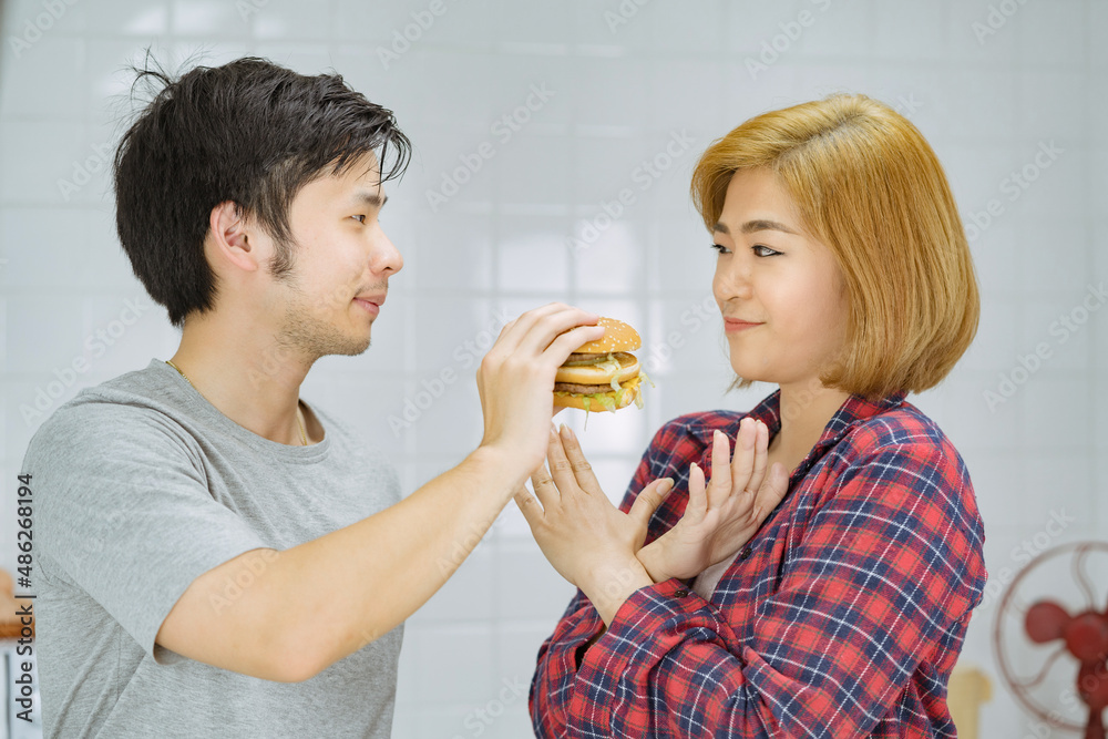 asian couples not eat fast food burger unhealthy, american calories fat meal Junk food . asian couples not eat fast food burger unhealthy, american calories fat meal Junk food .