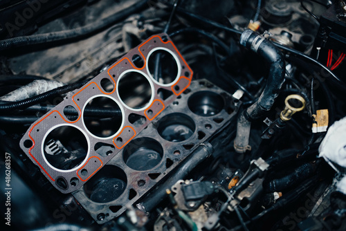 replacement of the cylinder head gasket in the car engine. photo