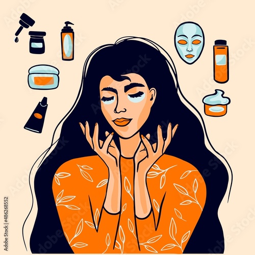 Young girl takes care of her face skin and uses cosmetics