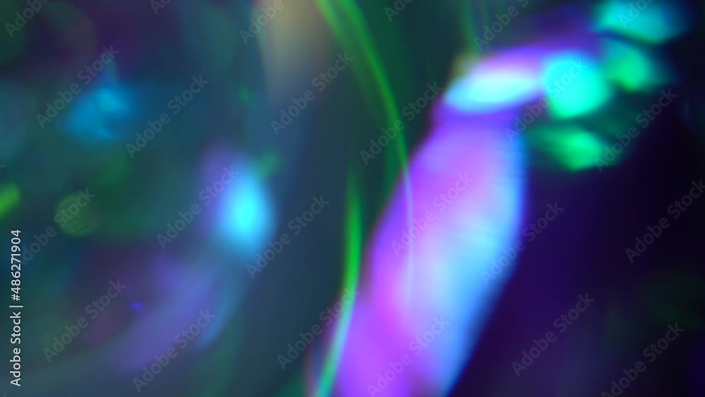 Optical illusion, refraction of light through a prism. Trending holographic blue green purple gradient background. Glares beams and bokeh