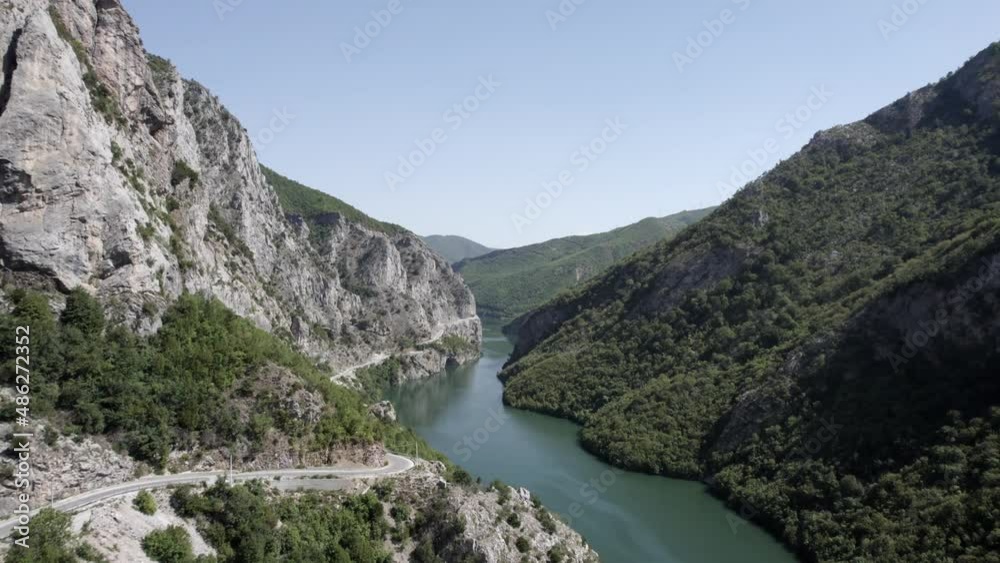 Drone video of Front Plane ascending over the River Drin at Valbona Pass in Kukes County, flying over a hairpin bend. Drone video of Front Plane ascending over the River Drin at Valbona Pass in Kukes County, flying over a hairpin bend.