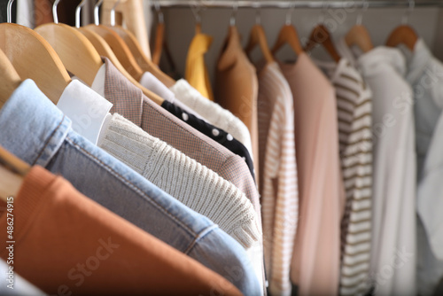 Wardrobe closet with different stylish clothes, closeup