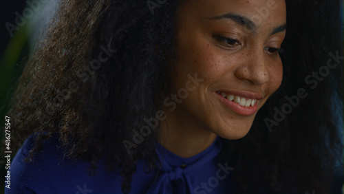 Happy african american woman professional talking video chat online in office. © stockbusters