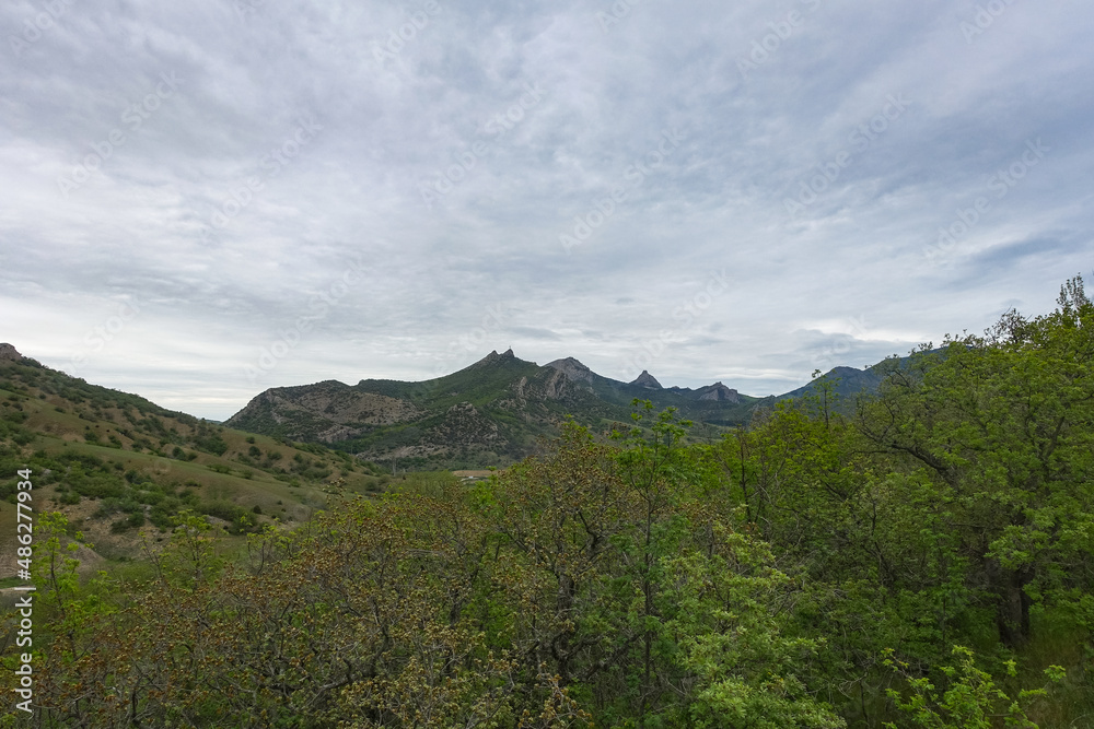 View of the gorge of the Echki-Daga mountain. Picturesque view of the Crimean mountains. Fox Bay. Crimea. Russia. View of the gorge of the Echki-Daga mountain. Picturesque view of the Crimean mountains. Fox Bay. Crimea. Russia.