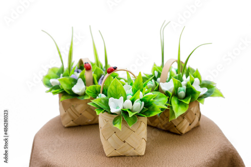 Three bouquets of handmade soap snowdrops in veneer baskets