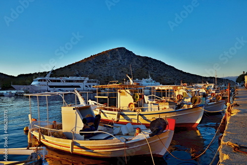 Greece-view of the sunrise in harbor in Tolo