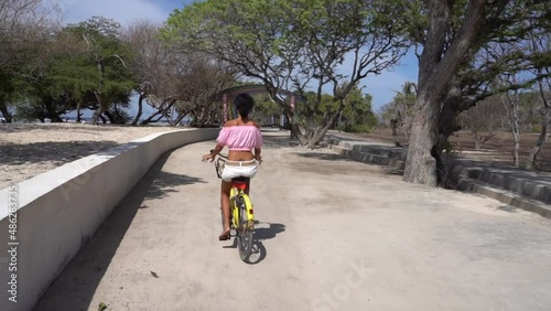 Travelling with a charming woman on a bicycle in the park, leisure activity in summer, sightseeing journey 