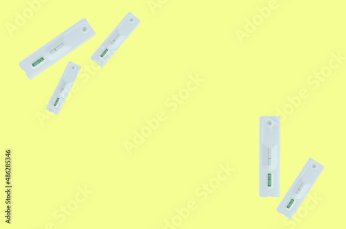 Covid-19 negative test result with (ATK) SARS CoV-2 rapid antigen test kit isolated on yellow background.