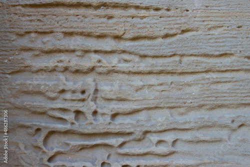 Detail of washed out natural brown sandstone texture, full frame for background
