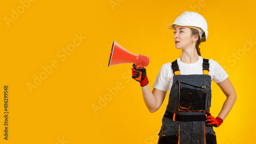 Megaphone in builder hand. ...