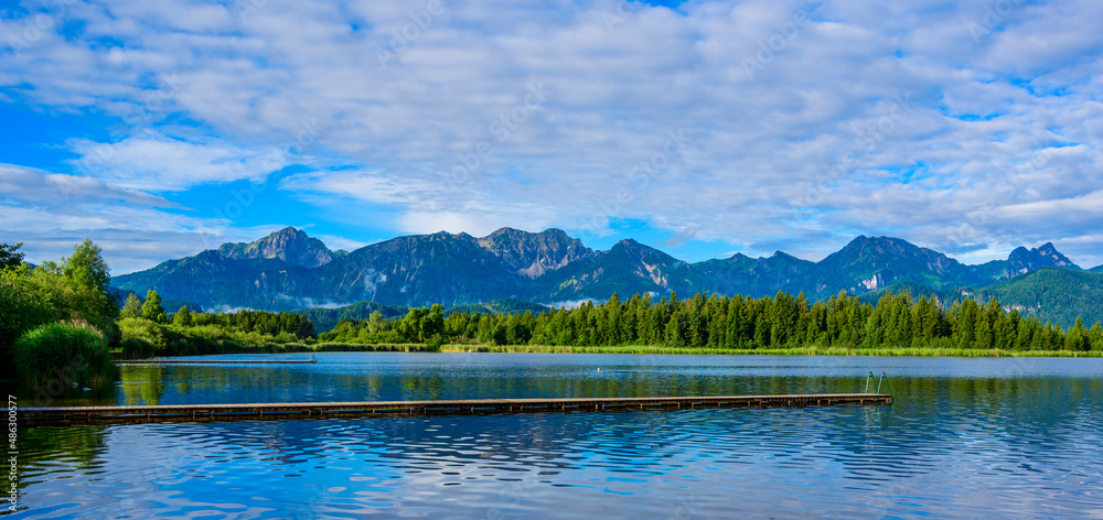 Lake Hopfensee near Fuessen - View of Allgaeu Alps, Bavaria, Germany - paradise travel destination Lake Hopfensee near Fuessen - View of Allgaeu Alps, Bavaria, Germany - paradise travel destination