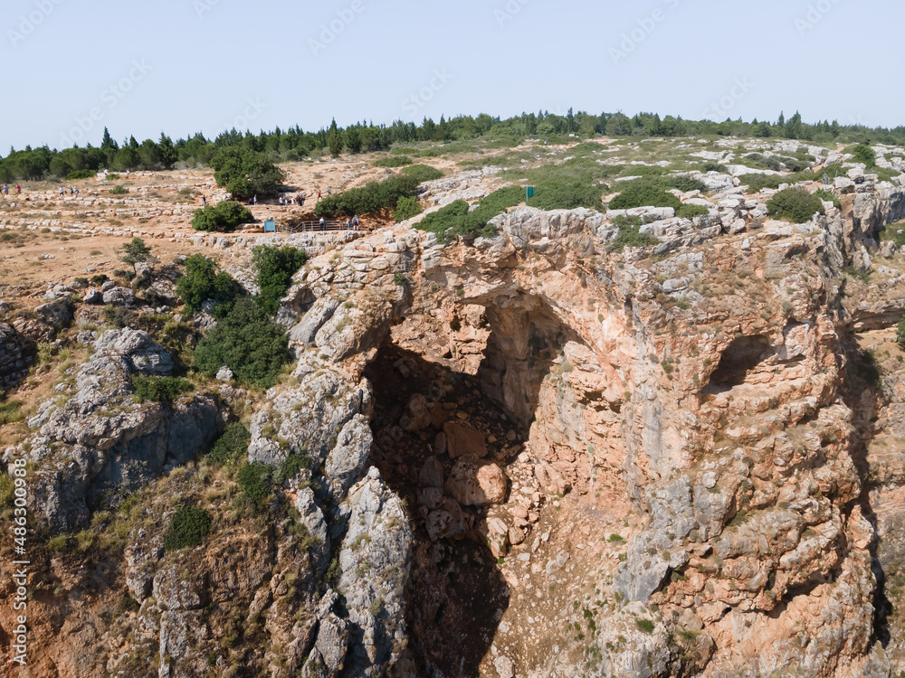 The Keshet  Cave - ancient natural limestone arch spanning the remains of a shallow cave with sweeping views near Shlomi city in Israel