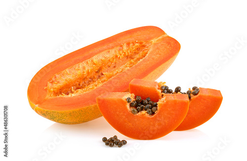 whole and half ripe papaya isolated on white background