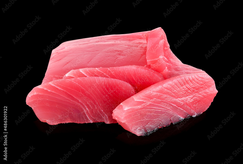 Raw tuna fish isolated on black background Raw tuna fish isolated on black background