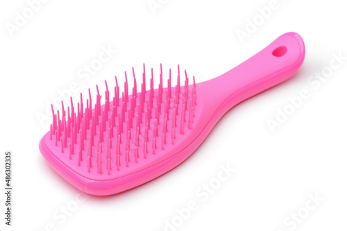 Pink plastic hair brush with soft silicone bristles