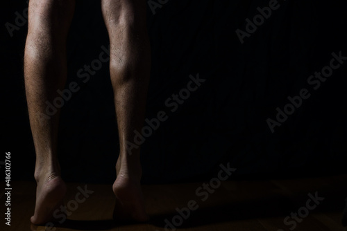 man back legs in black stockings