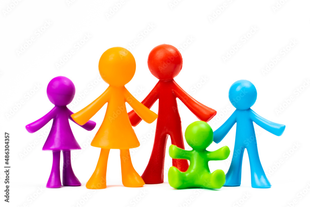 Figurines of the family stand on white isolated background. Concept of classic traditional family, values, unity and loyalty, strong and healthy. Society, procreation photo