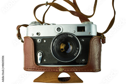 Vintage film camera with leather case. Isolated on white background.