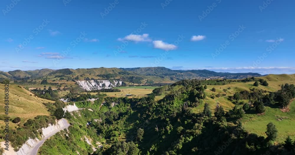 Summer morning aerial over bush clad valley escarpment - Mangaweka NZ Summer morning aerial over bush clad valley escarpment - Mangaweka NZ