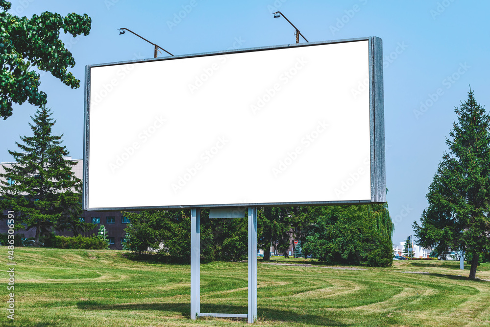 Blank billboard mockup with white screen. Against the backdrop of nature and blue sky. Business concept. Copy space banner for advertising. Blank billboard mockup with white screen. Against the backdrop of nature and blue sky. Business concept. Copy space banner for advertising.