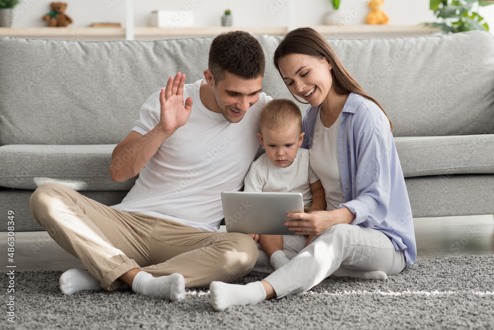 Online Communication. Family With Little Baby Making Video Call On Digital Tablet Online Communication. Family With Little Baby Making Video Call On Digital Tablet