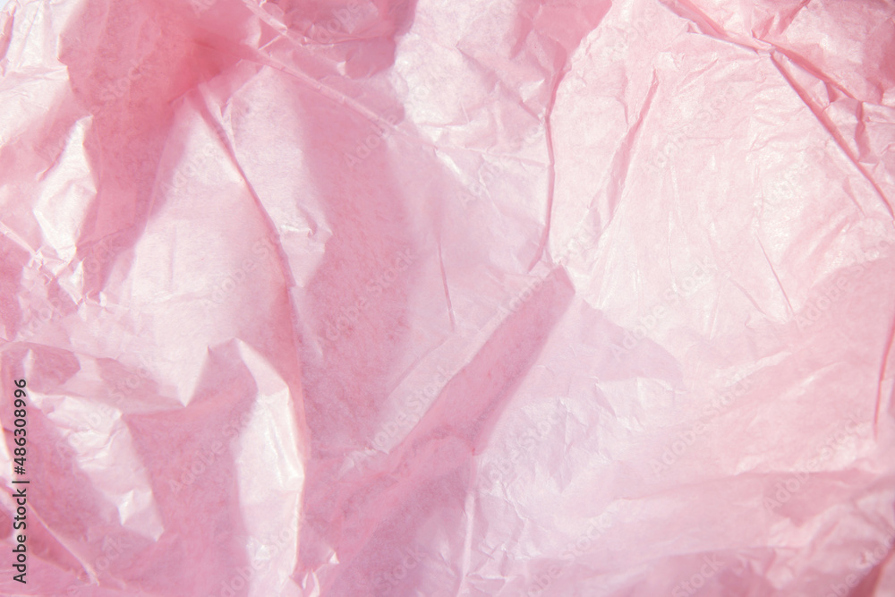 Fototapeta premium Abstract bright pink background. Squeezed multicolored craft paper.