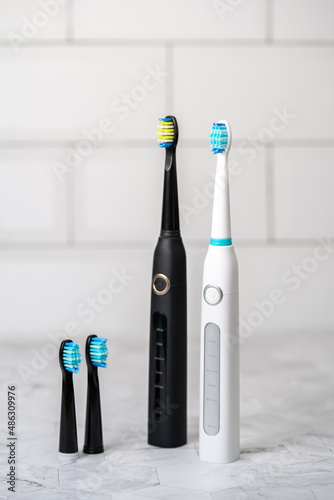 Modern electric toothbrush in a bathroom. Professional dental care.