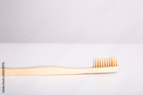 wooden eco friendly toothbrush with cup  bamboo toothbrush on white background