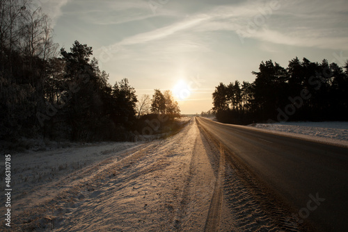 traces of cars in the snow in winter