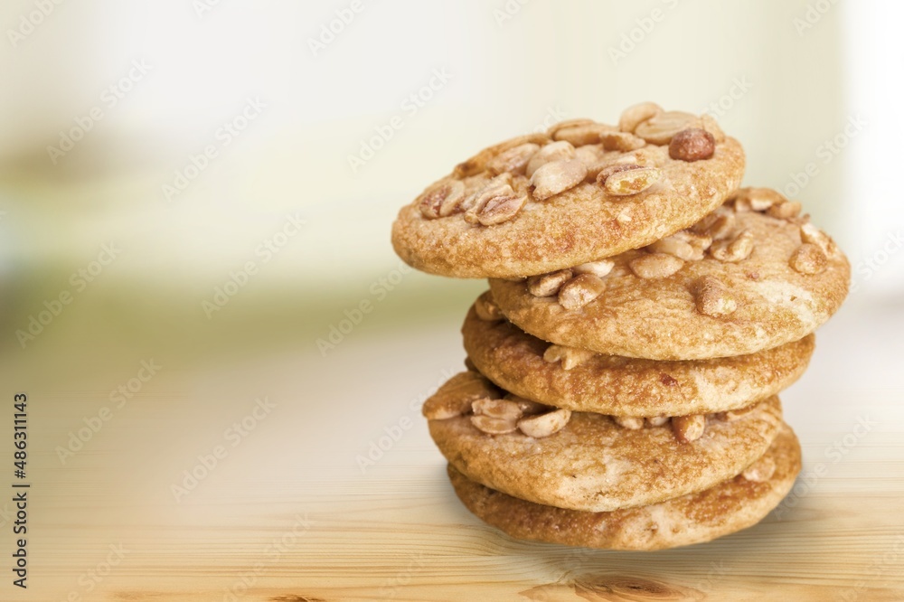 Peanut butter cookies stack on wooden board. Traditional american dessert, nutrition snack, dessert or breakfast food. Peanut butter cookies stack on wooden board. Traditional american dessert, nutrition snack, dessert or breakfast food.