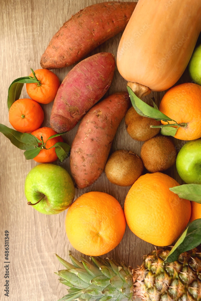 Various healthy fruit and vegetable on wooden background. Top view. Various healthy fruit and vegetable on wooden background. Top view.
