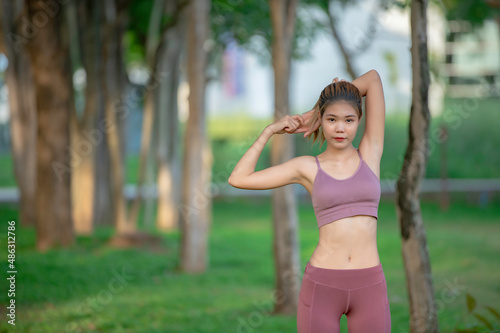 Asian beautiful slim woman at the park,Young girl love healthy exercise,Teen wear sportswear