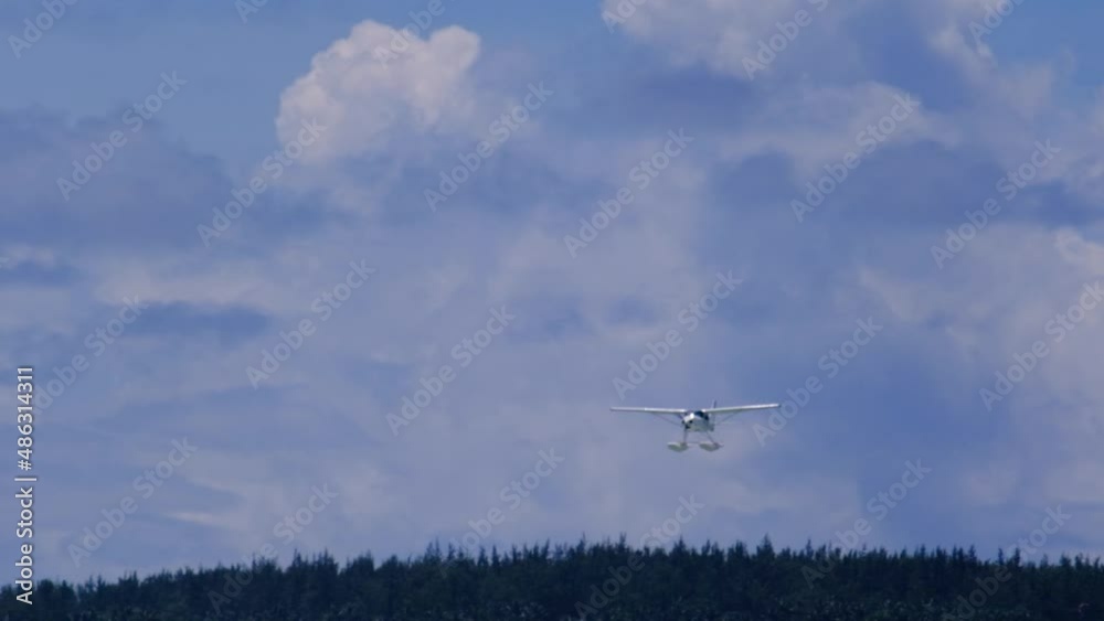 Slow motion view of a float plane landing near Le Morne in Mauritius