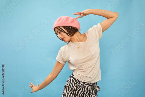 Studio shot of stylish woman in pink beret photo