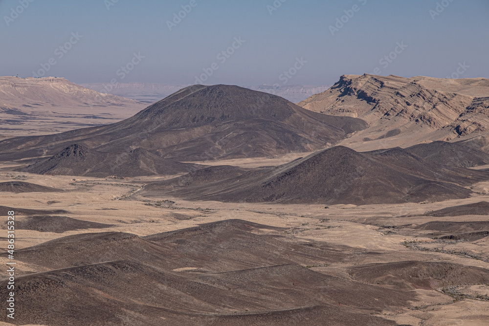 View of Ramon Crater from West to East as seen from Mount Ramon, a 500 m deep, the world's largest erosion cirque, located in the Negev Desert, south of Beer Sheba, Israel. View of Ramon Crater from West to East as seen from Mount Ramon, a 500 m deep, the world's largest erosion cirque, located in the Negev Desert, south of Beer Sheba, Israel.